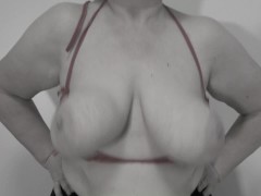 A mature milf shakes her big natural saggy tits.