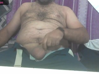 Masculine Turk Bear Plays with a Cock at Home because of Boredom
