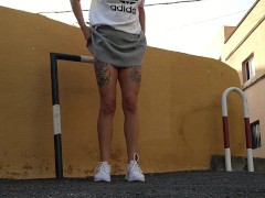 Pretty girl pees in public