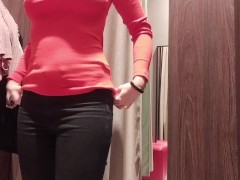 showing tits through the open curtain in the fitting room, surprising a stranger