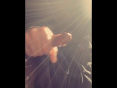 Young mixed male playing with his cock in parking lot