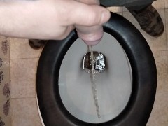 A COUPLE PEES IN A PUBLIC TOILET WITH GOLDEN SHOWER FOR HIM