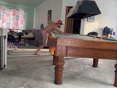 Playing billard wearing pink panties only