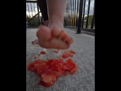 Squishing a juicy tomato with my bare feet, the juices squirted everywhere!