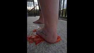 Squishing a juicy tomato with my bare feet, the juices squirted everywhere!