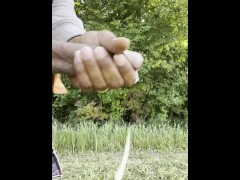 Jerking off in a field