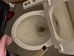 Japanese man pees in the toilet