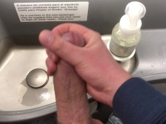 Big dick jerked off in airplane toilet