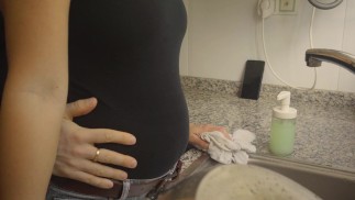 Washing dishes in black jeans