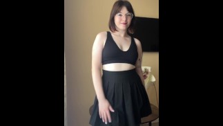 Chic brunette in skirt shows her panties under her skirt
