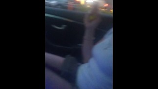 Pretty cougar smoking cigarettes while in car