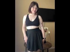 Chic brunette in a skirt shows off her body