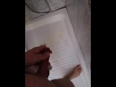 Young guy pees in the shower