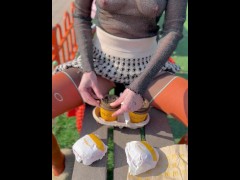 Naked drinking coffee in the park