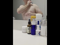 Shaving Face in Bathroom