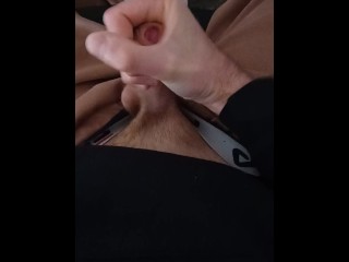 sporty guy jerks off in sweatpants and sneakers cums hard