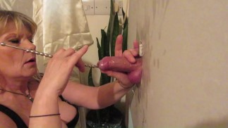 Blonde Amateur Milf at a gloryhole sticks a rod down his dick