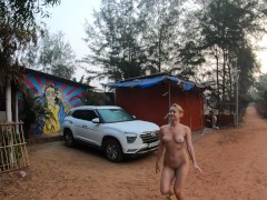 Nude girl walking around the campsite