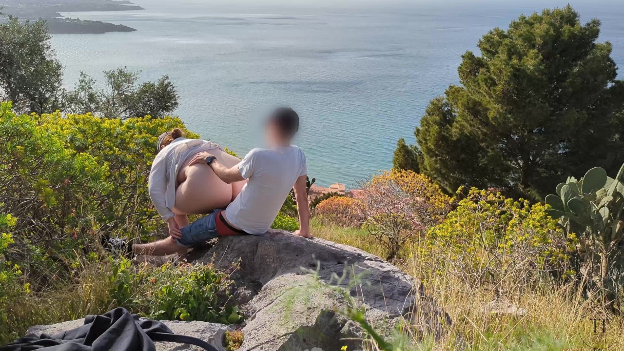 Spontaneous sex while hiking with a view over the city