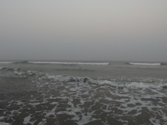 Nude girl swimming in the ocean