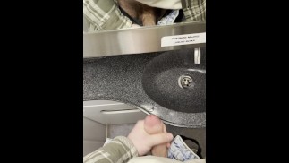 young twink jerks off his cock in a train toilet