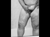 Chubby MILF shaves her pussy in the shower - black and white