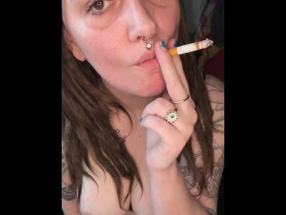 Smoking Brunette Plays With Her Titties