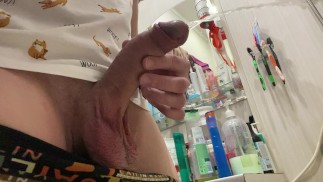 Morning pissing of uncircumcised penis in the bathroom