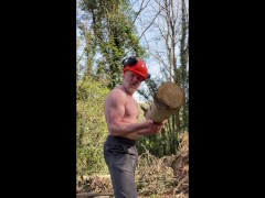 Muscular lumberjack Daddy flexes muscles, lifts tree stumps and jerks off near workmates in woods
