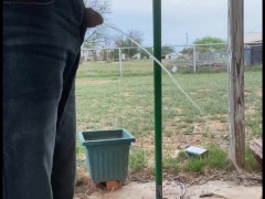 Sexy and sneaky public full bladder dick thru jeans fly outside piss while sweeping