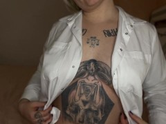 The blonde in the white shirt plays with her boobs