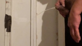 Taking a long very desperate piss in garage