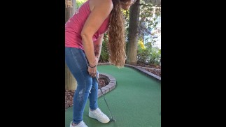 Pretty girl golfing and she completely miss the shot