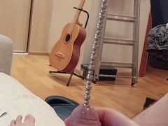 Beads string urethral insertion into bladder and close up