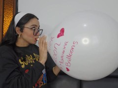 Marianna blows up a white balloon filled with red kisses to make it pop (Full video at C4S/OF/MV/Mem