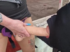 The slave learns to suck his Mistress's strap-on well and deeply.