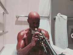 Playing trumpet during a hot bath