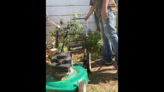 Lawn mower piss #2 (taking a desperate public piss outside on top of a different lawn mower)