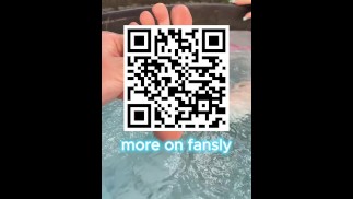 girl takes her foot out of the water in the pool