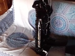 Total black with fishnets pantyhose and boots over the knee