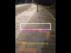 Dominatrix walking in high boots