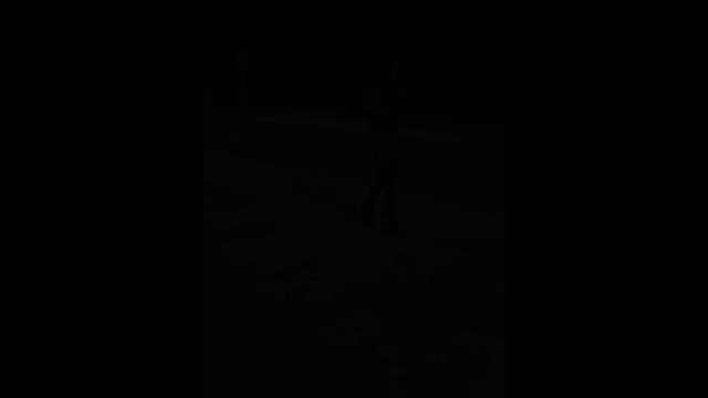 Dominatrix walking in high boots