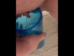 Peeing into a cup