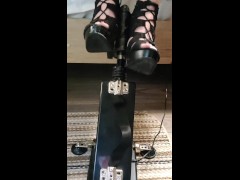 Giving a footjob in my strappy heels to a black cock on my fuck machine
