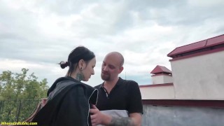 small ass stretched on a public rooftop