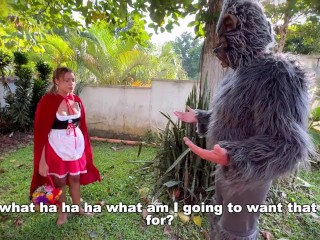 Little Red Riding Hood lost a fruit from her basket and is looking for it in the wolf's pants.