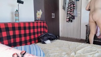 Amateur wife has fun trying on clothes and cutting them.