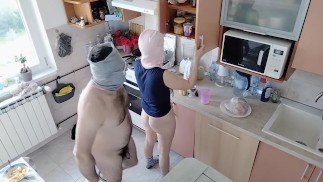Amateur couple having fun in the kitchen.