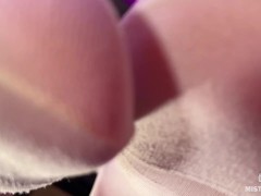 Under the Feet of the Mistress in White Pantyhose on the Bar Counter