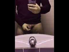 Hot man whips out his big soft cock in a public restroom